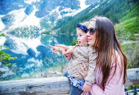 Mother with a baby on family summer holidaysの写真素材