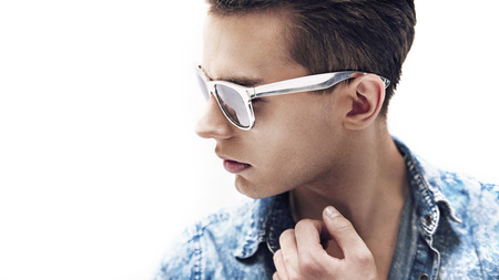 Young handsome guy wearing stylish sunglassesの写真素材