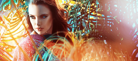 Beautiful brunette woman in the rain forestの写真素材