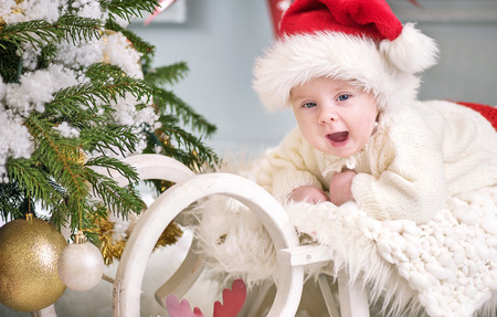 Portrait of a cute litle son celebrating Christmasの写真素材
