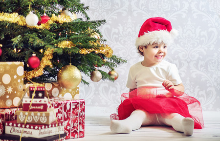 Portrait of a cute girl dressed up a santaの写真素材
