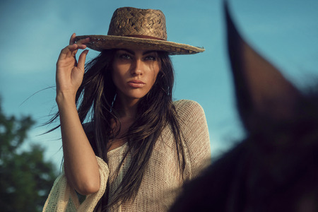 Portrait of a fabulous modelm riding an arab horseの写真素材