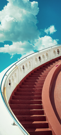 Stairs towards the blue sky with cloudsの写真素材