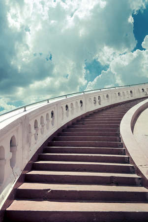 Stairs towards blue sky with fluffy cloudsの写真素材