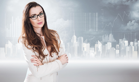 Businesswoman posing on a diagram backgroundの写真素材