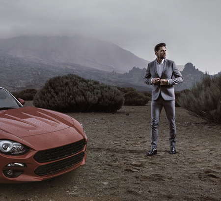 Portrait of a handsome, rich businessman in a tropical placeの写真素材