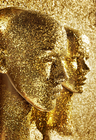 Two heads of human golden scuplturesの写真素材
