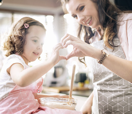 Pretty mom having a great time her daughterの写真素材