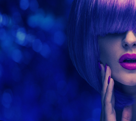 Colorful portrait of a woman wearing fashionable hairpieceの写真素材