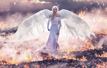 Conceptual portrait of an angel walking on the hell flamesの写真素材