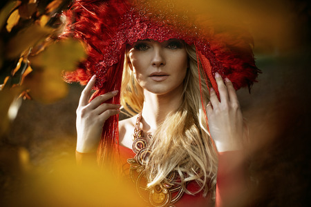 Beautiful blond woman wearing a red, elegant coronetの写真素材