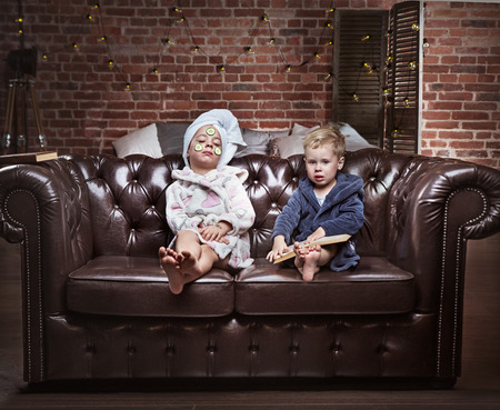 Conceptual portrait of cheerful children having a spa treatmentの写真素材