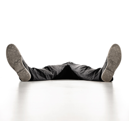 Young, tired businessman having a nap - isolatedの写真素材