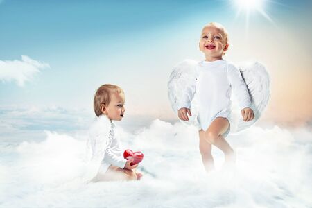 Conceptual picture of cute, little angels in heavenの写真素材