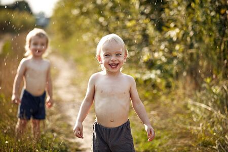 Portrait of cheerful, relaxed kids enjoying vacation timeの写真素材