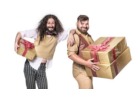 Two cheerful ners holding bunch of giftsの写真素材