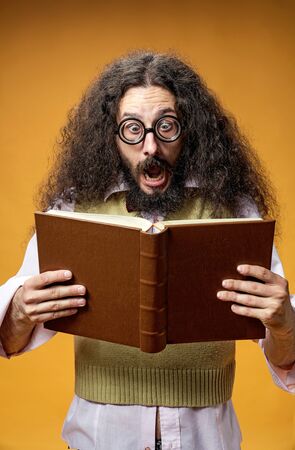 Funy geek surprised of a book contentの写真素材
