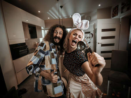 Funny couple spending time together at home