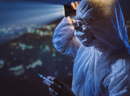 Medical worker invent vaccine  . Pandemic Laboratory worker holding syringe with vaccine.の写真素材