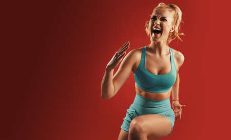 Portrait of sweaty blonde woman take a break after intense workout.