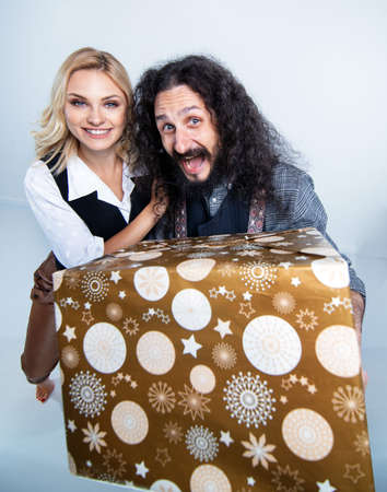 Funny hipster couple posing on white background