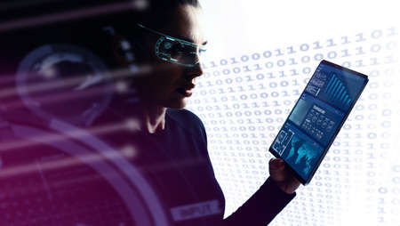 Concept of future technology or entertainment system, virtual reality. Female portrait lit by HUD interfaceの写真素材