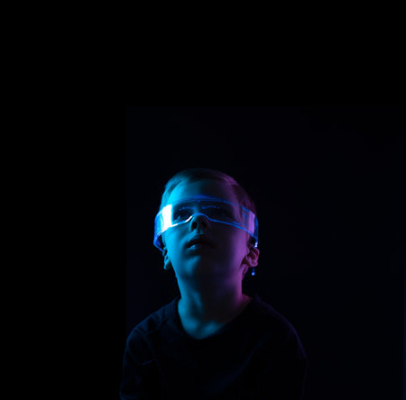 Cute little boy using digital glasses. sci-fi, earth awareness, future mind controlling conceptの写真素材
