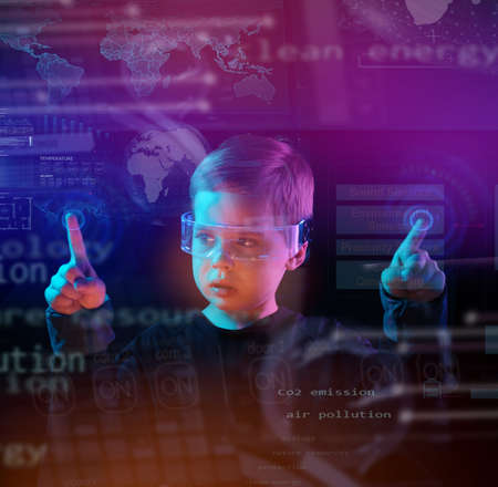 Cute little boy using digital glasses. sci-fi, earth awareness, future mind controlling conceptの写真素材