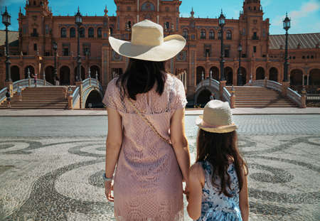 Loving mother and her cute daughter exploring city on a sunny summer day.の写真素材
