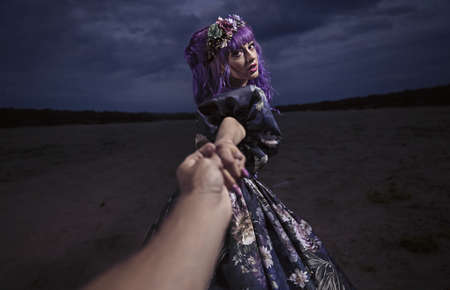 beautiful woman with owl in the natureの写真素材