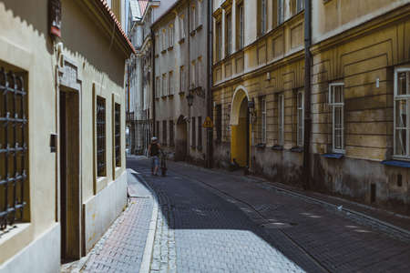 man with bicycle at the old streets of Warsawの写真素材