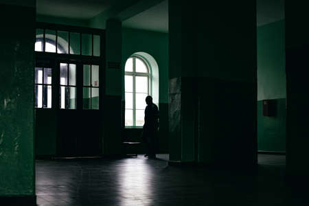 silhouette of a man, hall of train station, Polandの写真素材