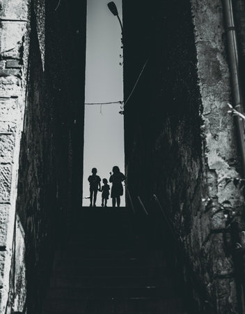 kids silhouettes at the top of the stairs