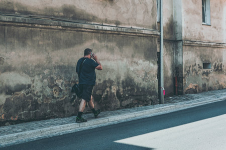 man with the bag on the decaying streetの写真素材