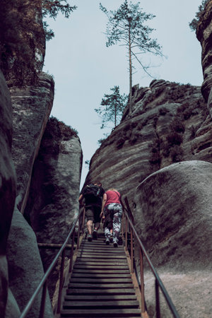 people on the wooden stairs in the mountainsの写真素材