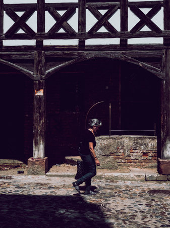 historical building with white facade, woman on the street