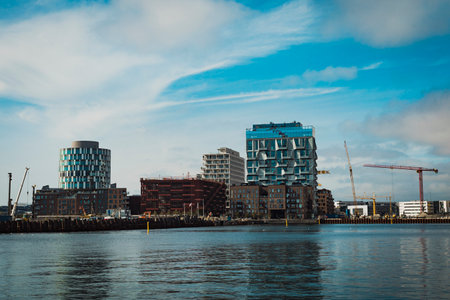 modern buildings under construction by the waterの写真素材