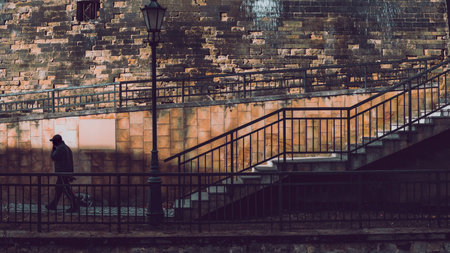silhouette of a man against the background of city wallsの写真素材