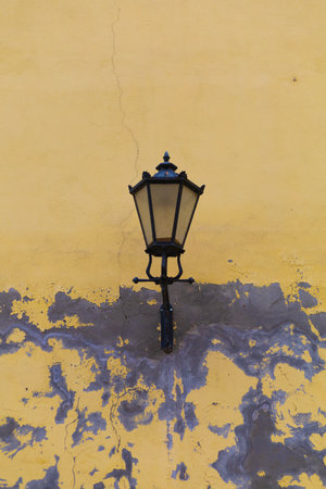 street lamp on the yellow wallの写真素材