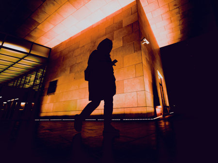 silhouette of person on night city streetの写真素材