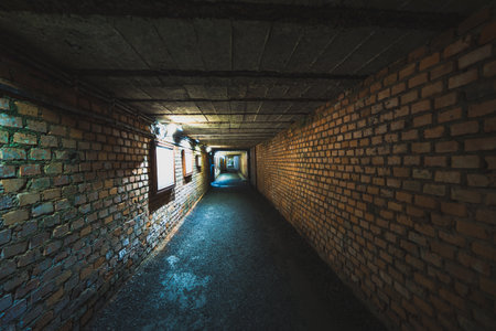 concrete underground tunnel with brick wallsの写真素材