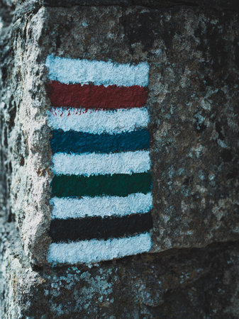 colorful stripes of paint on a stone wall