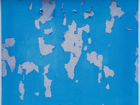peeling blue paint on the wallの写真素材