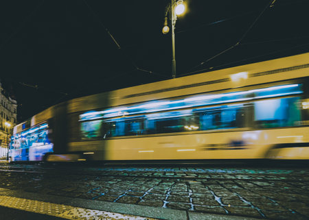 tram in movement at nightの写真素材