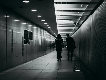 rear view of people walking along the subwayの写真素材