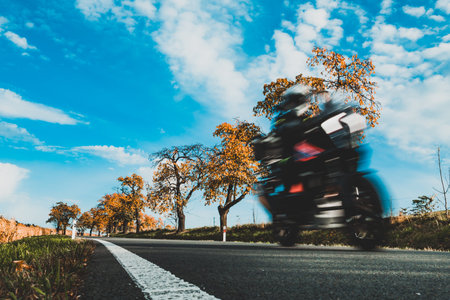 motorcyclist on the move on the roadの写真素材