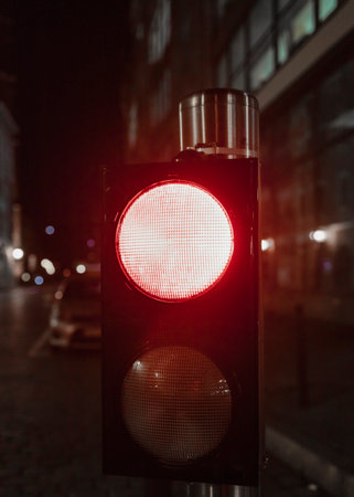 red stop light at nightの写真素材