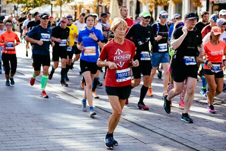 WARSAW, POLAND - SEPTEMBER 30, 2018: Runners compete at 40th Warsaw Marathon. Photo with shallow...