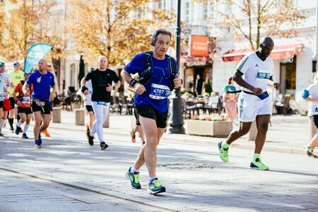 WARSAW, POLAND - SEPTEMBER 30, 2018: Runners compete at 40th Warsaw Marathon. Photo with shallow depth of field.のeditorial素材