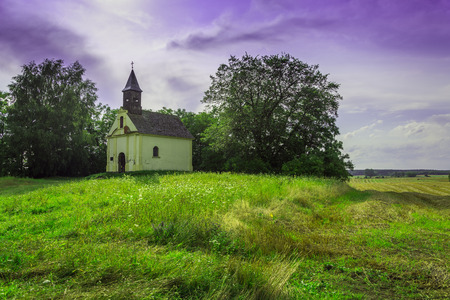 Lonely little church in the middle of field between the villages of Rokitno and Lubikowo - Polandの写真素材